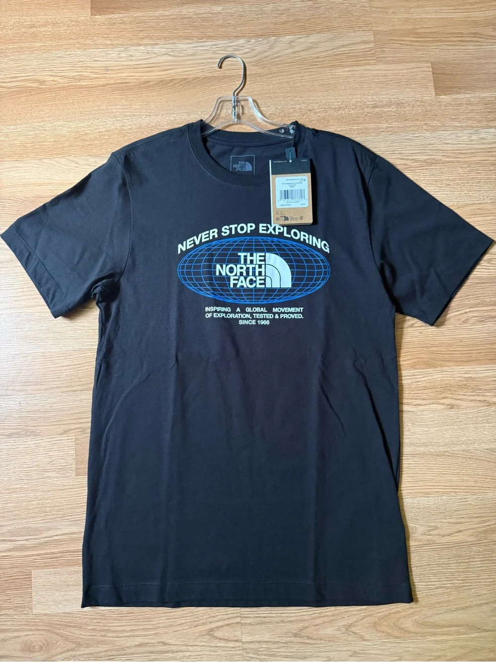 The North Face Black Short-Sleeve Tee with Blue Globe Graphic